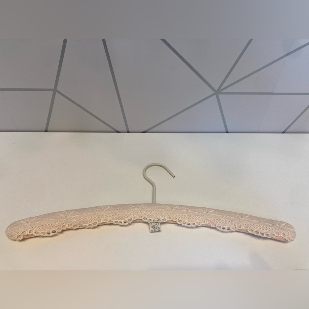 Vintage pale pinky puffy hanger with lace pattern overlay